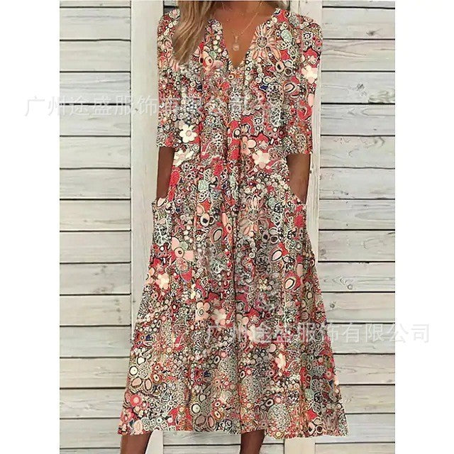 Dame maxikjole med florale accenter og praktiske lommer Stilla