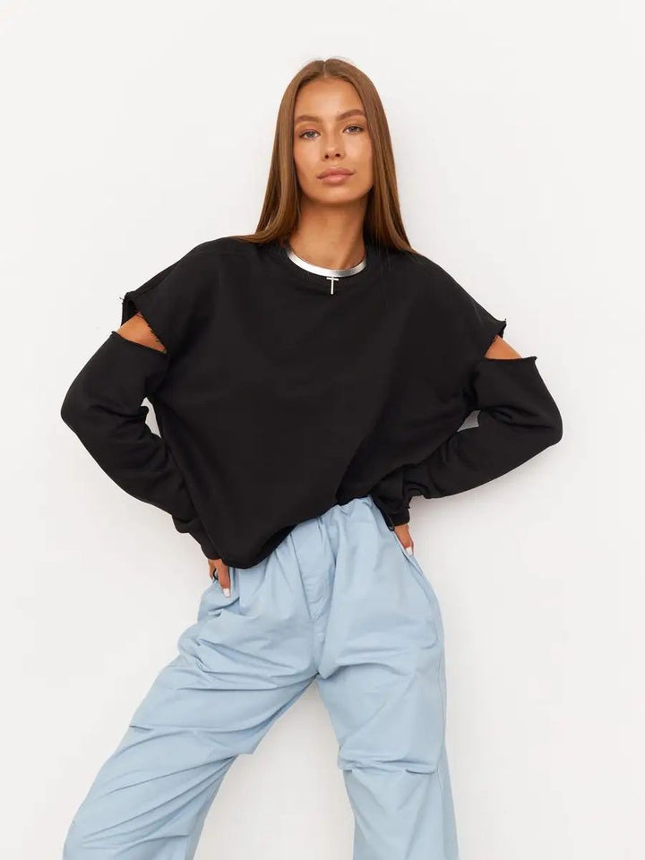Dame afslappet sweatshirt med asymmetrisk cut-out-detaljer og oversized snit Stilla
