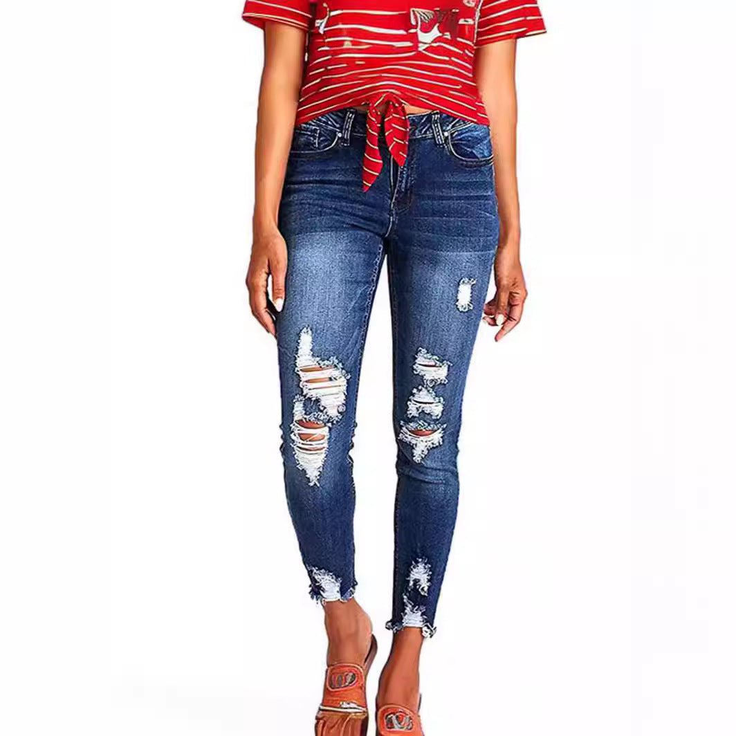 Dame Skinny Jeans med modetrend Destroyed-effekt og figurskærende snit Stilla