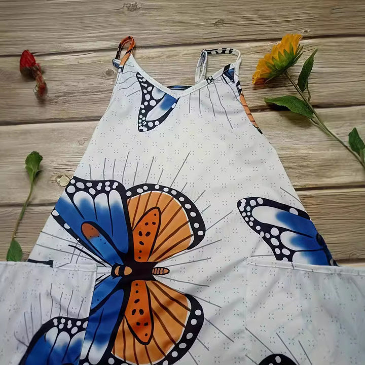 Dame jumpsuit med farverigt sommerfuglemønster og praktiske lommer Stilla