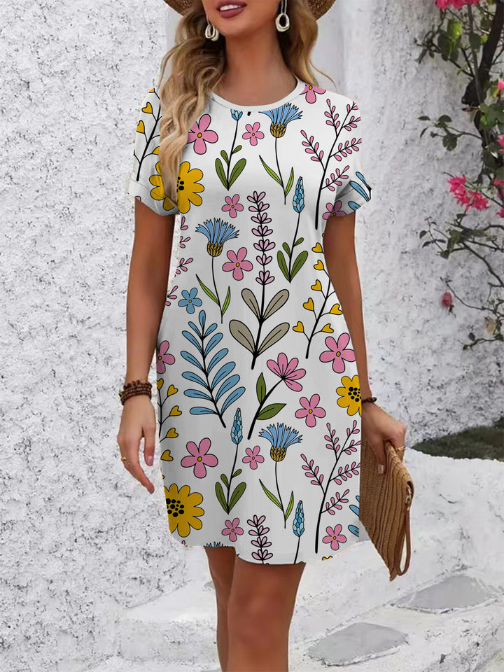 Dame afslappet T-shirt kjole med farverigt blomsterprint og behagelig pasform Skovae