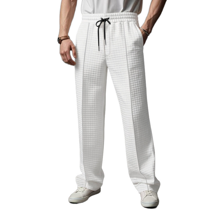 Herrer løstsiddende sportsbukser lavet af åndbart materiale med elastisk talje og moderne skrålommer Stilla