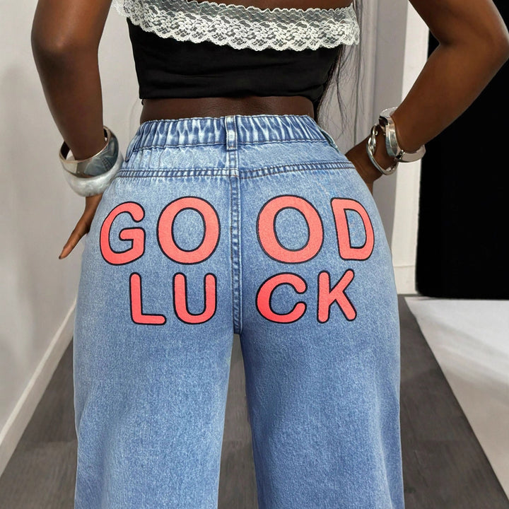 Damernes højtaljede wide-leg jeans med statement print Stilla