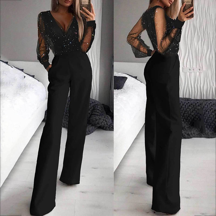 Damernes elegante jumpsuit med transparente ærmer og glitrende detaljer Skovae