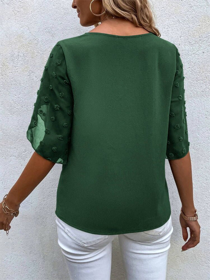 Dame elegant bluse med puffærmer og strukturerede detaljer Stilla