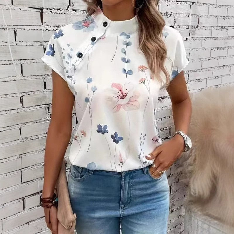 Damebluse med blomsterdesign og capærmer Stilla