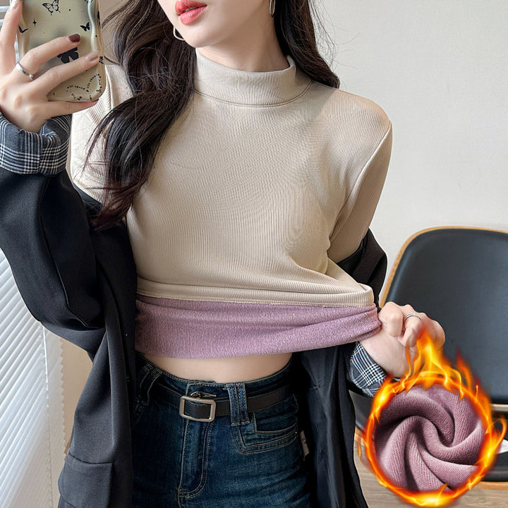 Kvinders langærmet cropped top med høj krave og ribbet tekstur Stilla