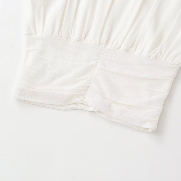 Dame mode oversized top med raffineret bånd Skovae