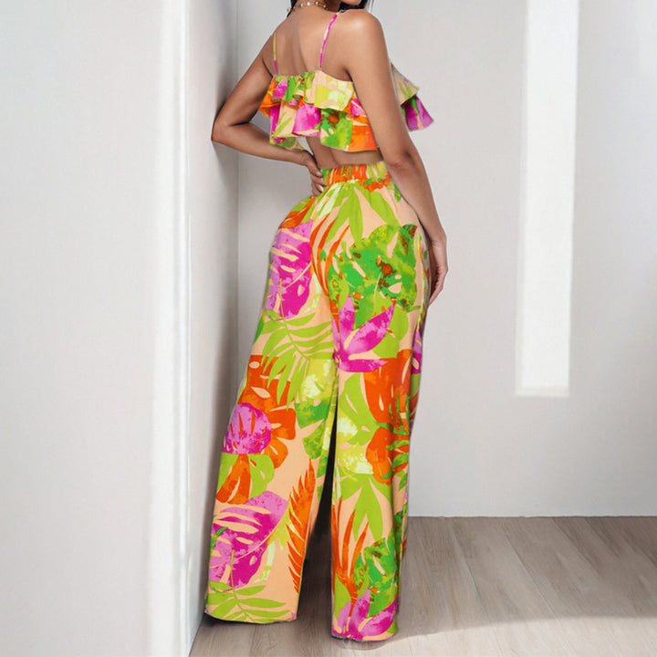 Dame to-delt sommeroutfit med ruffle-bluse og vide bukser Stilla