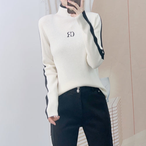 Dame elegant rullekrave sweater med kontrastærmer og moderne design Stilla