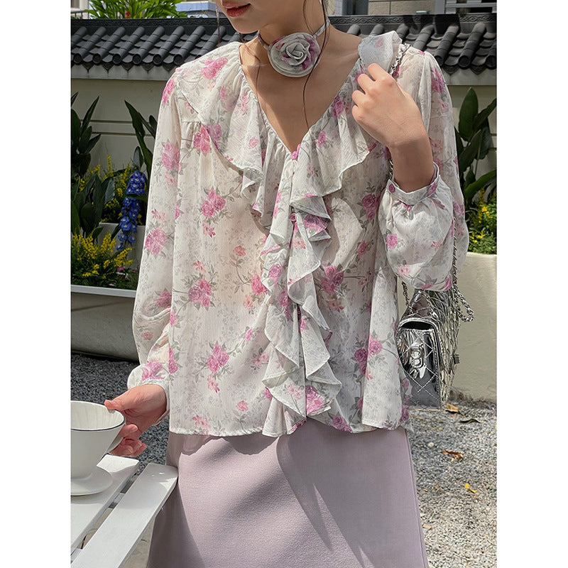 Dame rynket bluse med blomsterdesign og sarte detaljer Stilla