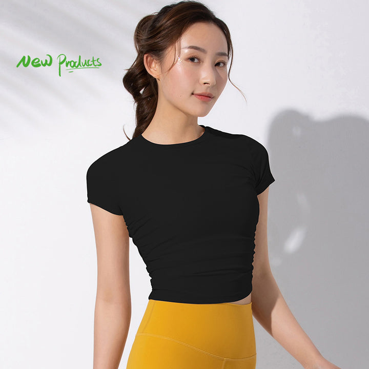 Dame sporty kortærmet crop-top med fashionable rynkeelementer og elastisk pasform Stilla