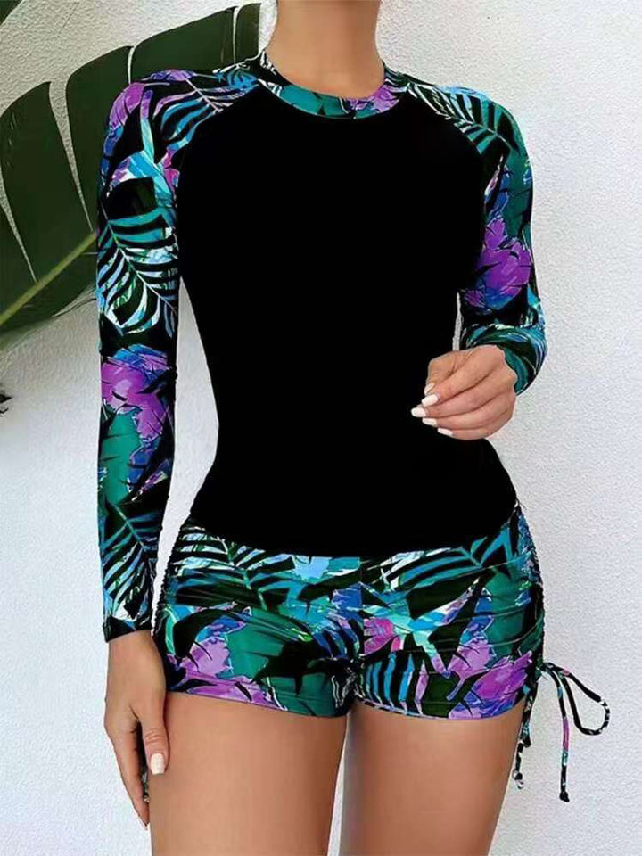 Dame Rashguard og shorts sæt med farverigt bladmønster Stilla