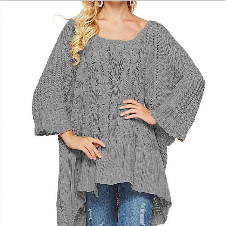 Women's chunky knit poncho with trendy cable pattern and wide sleeves Stilla