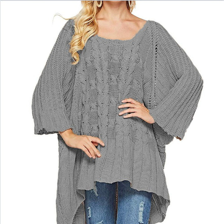 Women's chunky knit poncho with trendy cable pattern and wide sleeves Stilla