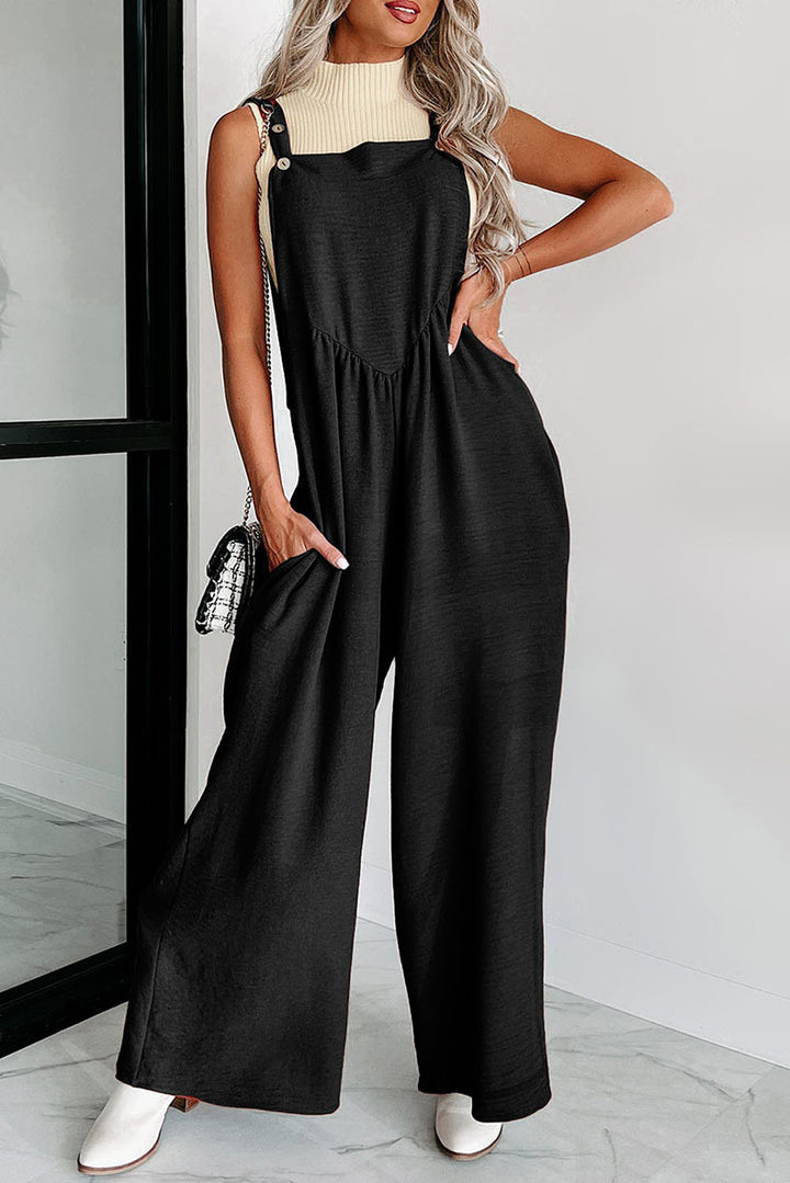 Damer over størrelse jumpsuit med bredt ben og elegante detaljer Stilla