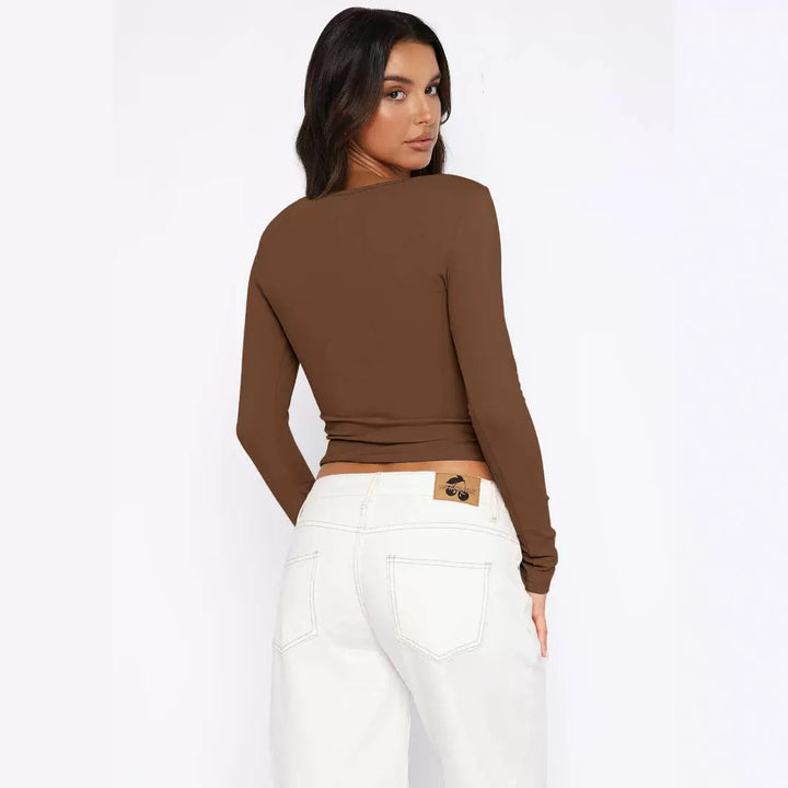 Dame langærmet knapdekoreret crop-top med raffineret krave Stilla