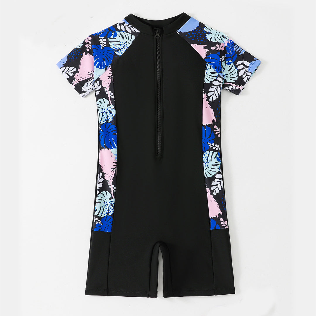 Dame én-delt surfdragt med blomsterdesign og kort snit Stilla