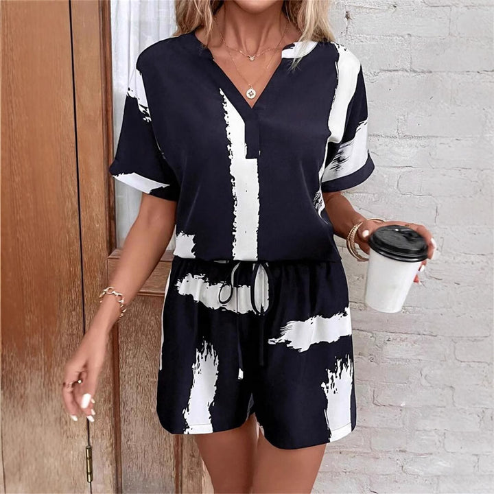 Damer kortærmet jumpsuit med moderne grafiktryk Stilla