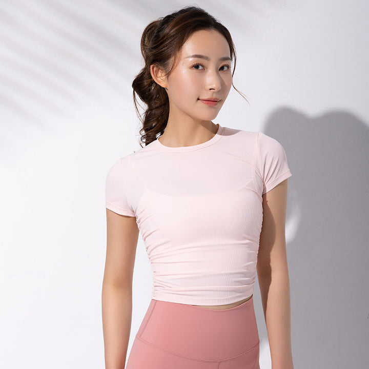 Dame sporty kortærmet crop-top med fashionable rynkeelementer og elastisk pasform Stilla