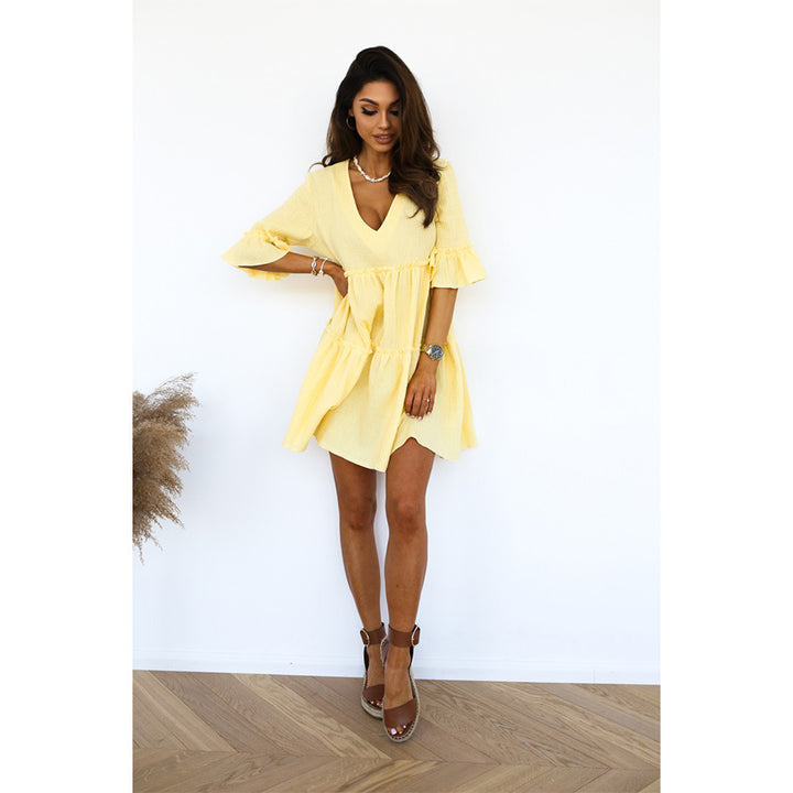Ladies wrap dress with voluminous ruffle details and V-neck Skovae