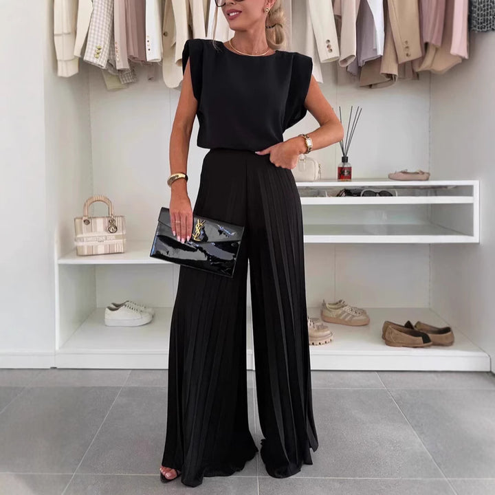 Dame jumpsuit med flydende blomsterprint og elegant talje Stilla