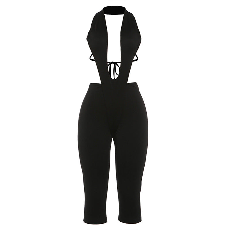 Dame figursyet jumpsuit med dyb V-udskæring og bælte Skovae