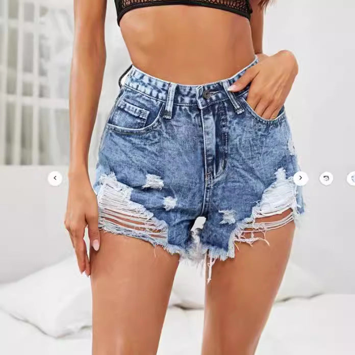 Dame Ripped Denim-Shorts med høj talje og fashionable distressed-look Stilla