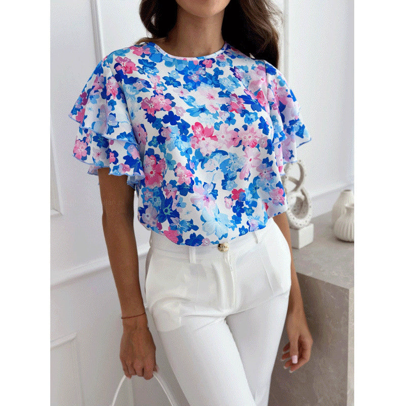 Damebluse med voluminøse flæseærmer og blomstermotiv Stilla