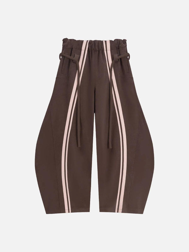 Dame casual bukser i sporty design med kontrasterende striber og elastisk talje.