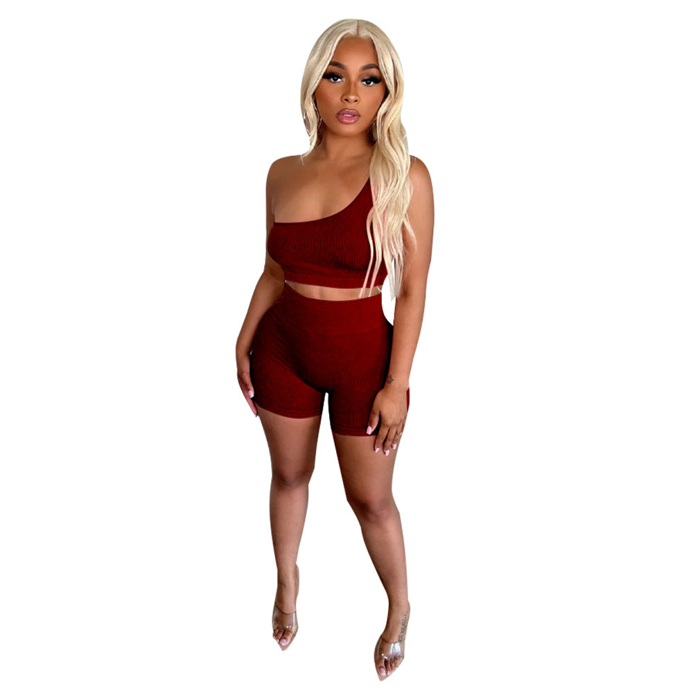 Dame sporty to-delt sæt med asymmetrisk crop-top og høje shorts Stilla