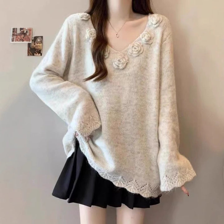Kvinders store strikket sweater med blomsterapplikationer Stilla