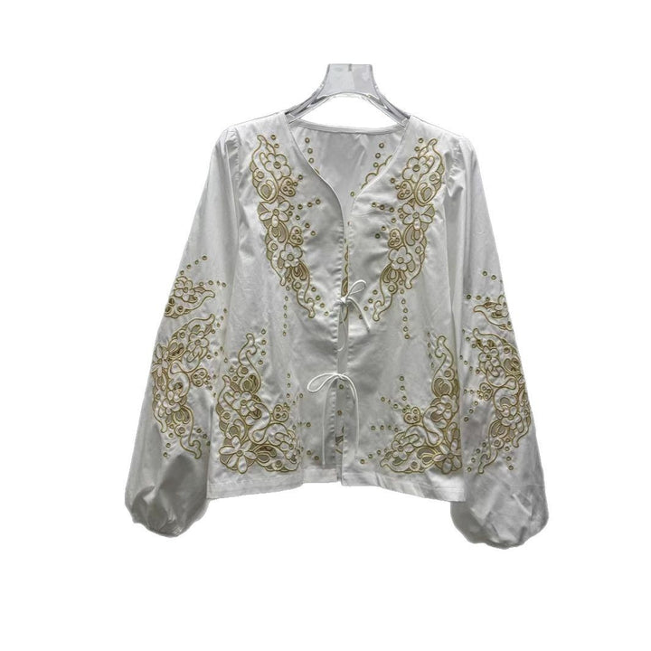 Damebluse med florale hulbroderier og afslappet skæring Stilla