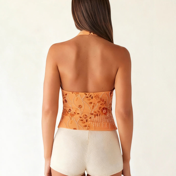Dame halterneck toppe med blomsterprint og skinnede applikationer Skovae