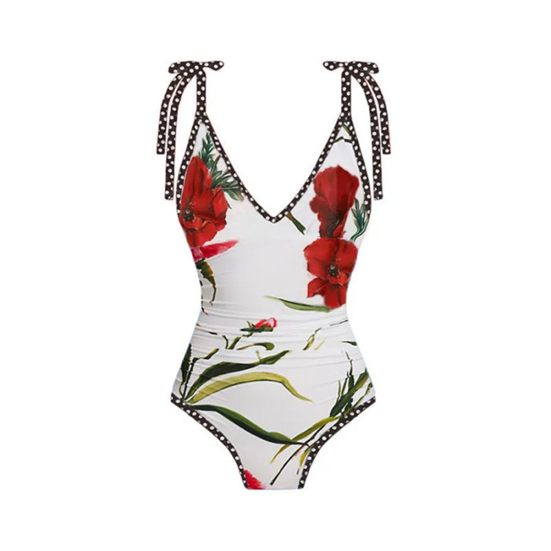 Dame One-piece badedragt med blomsteraccenter og matchende omslagsnederdel Skovae