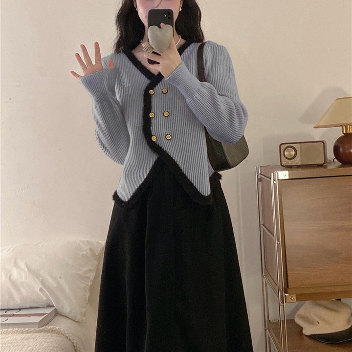 Kvindernes elegante cardigan med kontrastkant og knapdetaljer Stilla