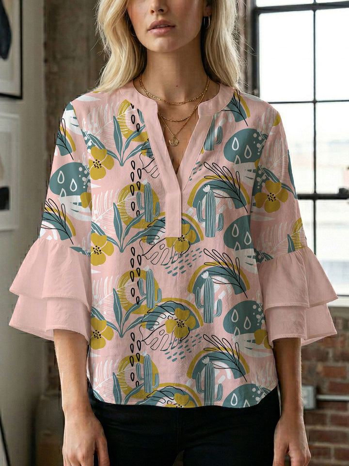 Dame bluse med voluminøse ærmer og kreativt trykdesign Skovae