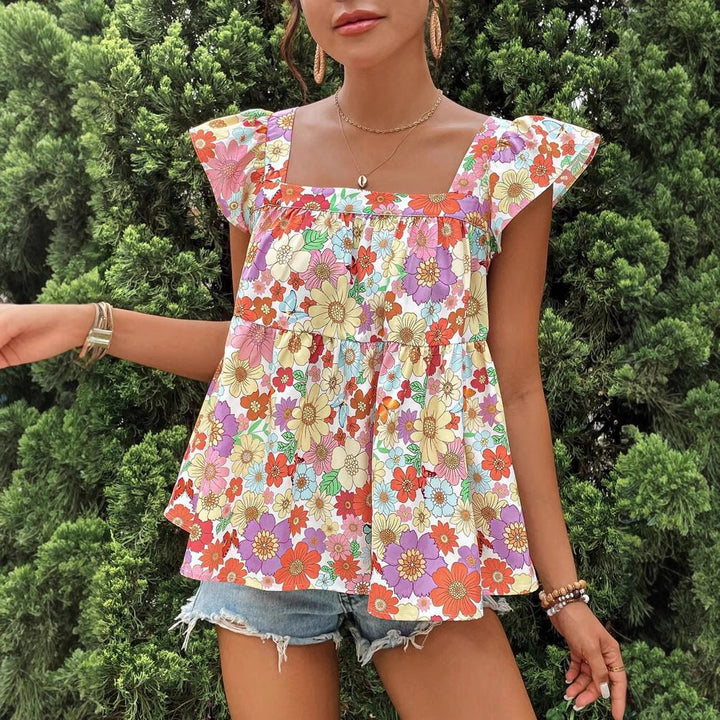 Dame bluse top med floralt print og flæsedetaljer Stilla