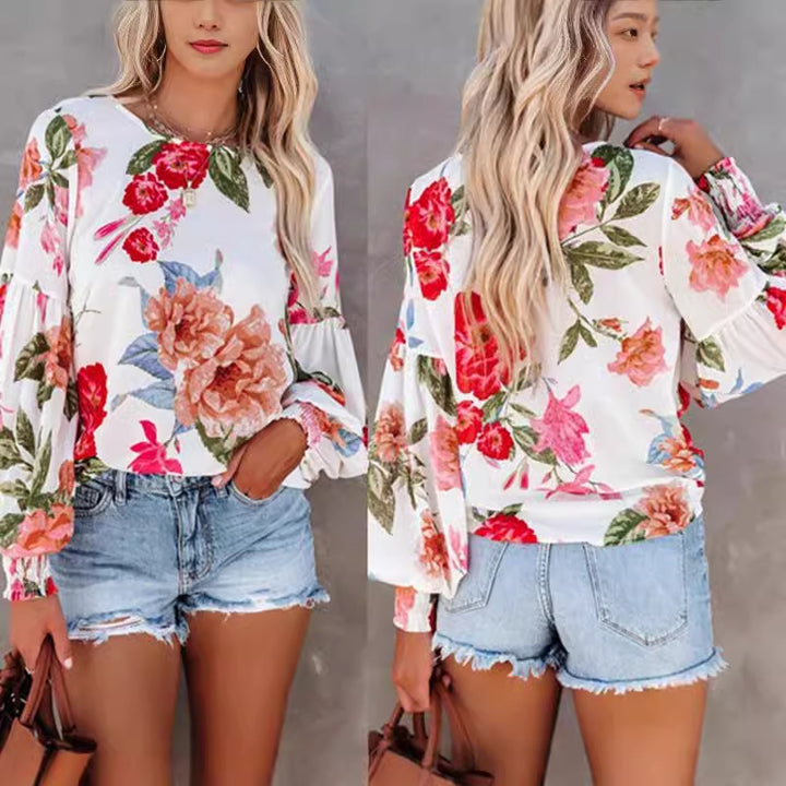 Damebluse med voluminøse ærmer og floral mønster Stilla