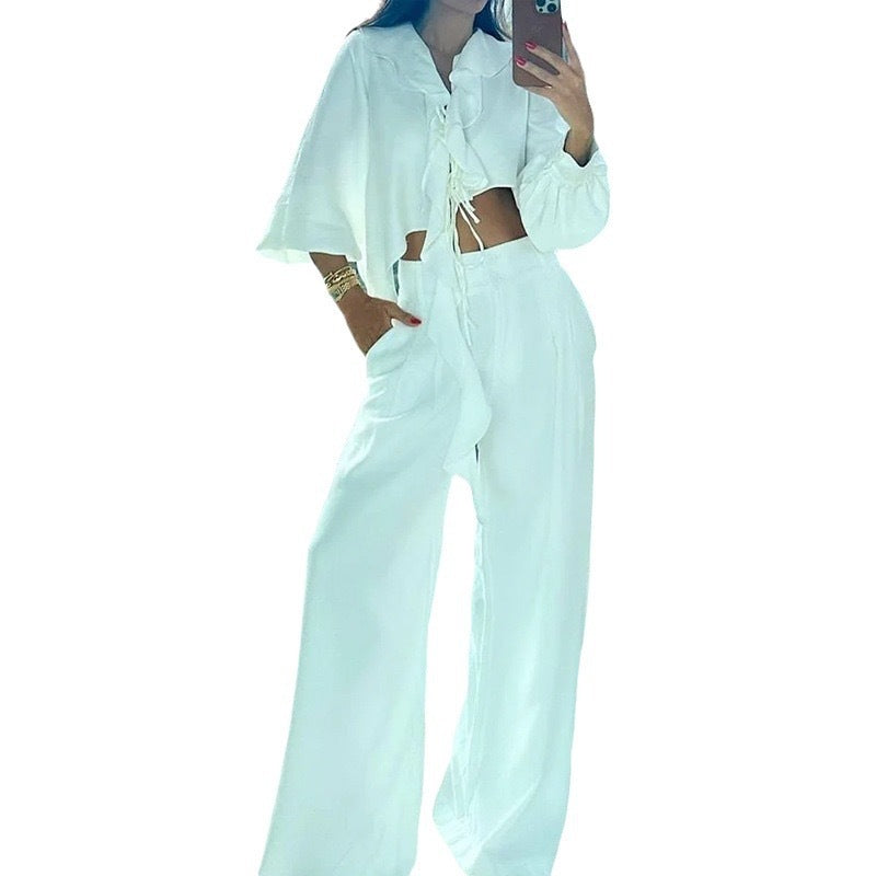 Dame to-delte sæt med asymmetrisk cropped top og brede bukser