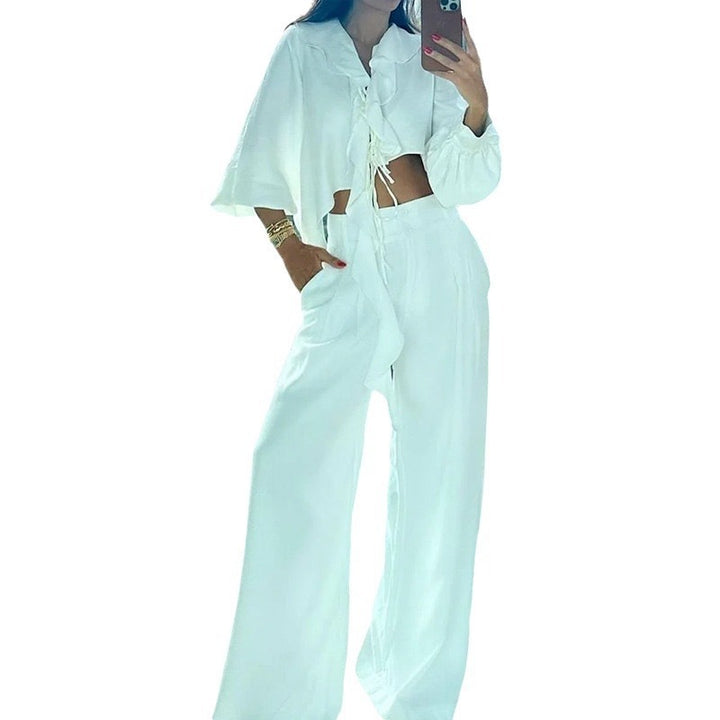 Dame to-delte sæt med asymmetrisk cropped top og brede bukser