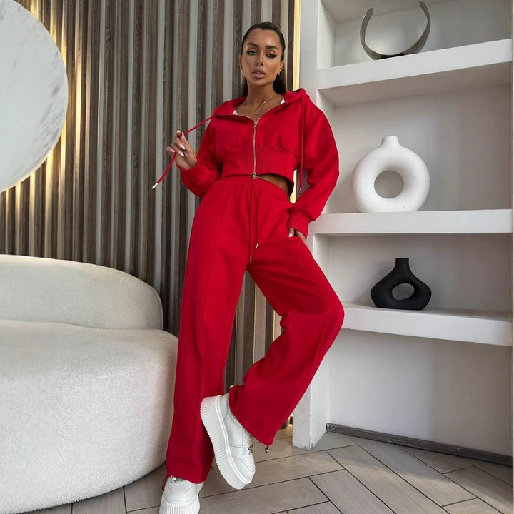 Kvindernes sporty to-delt sæt med cropped hoodie og løse joggingbukser lavet af elastisk materiale