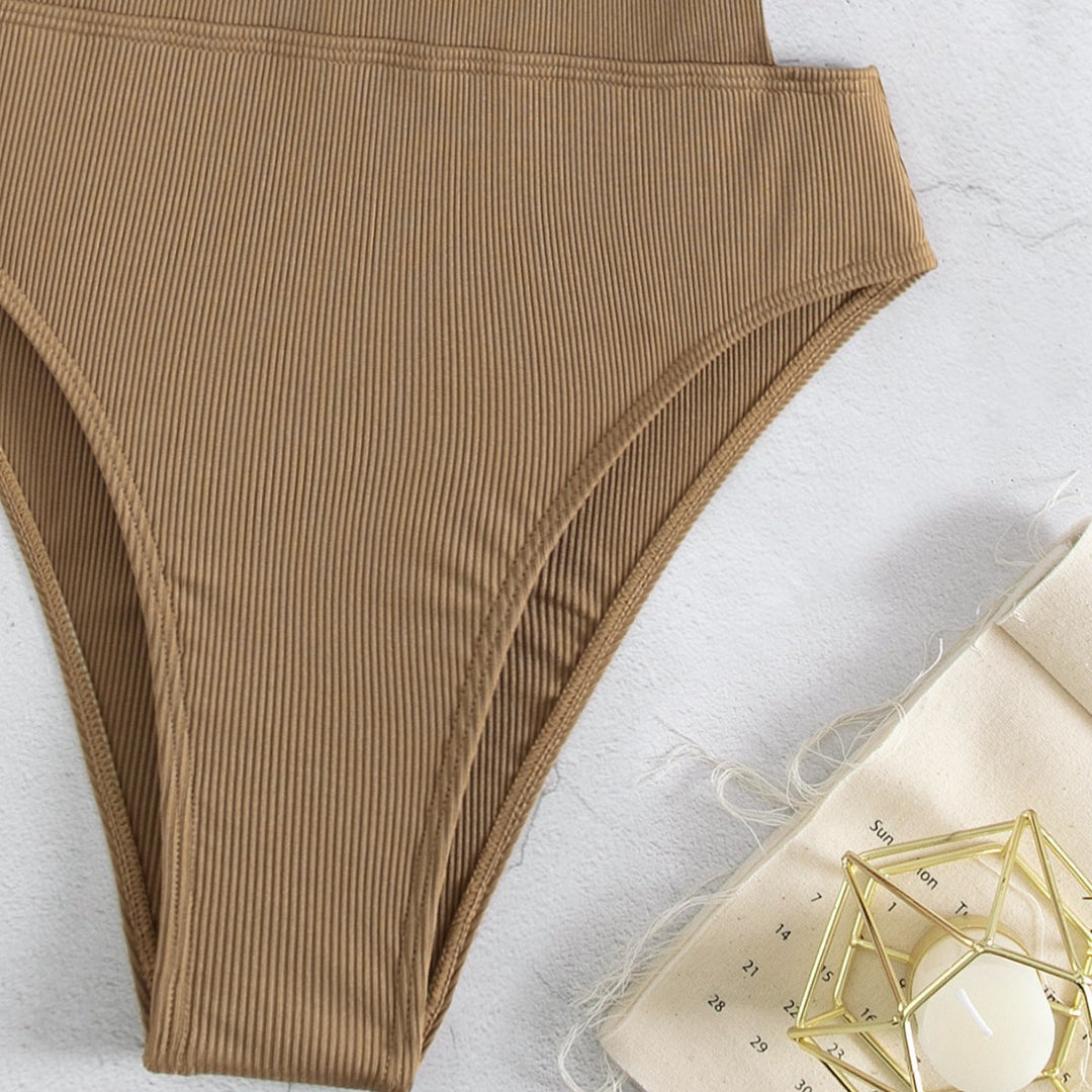 Dame one-piece badedragt med elegant schnit og sidelæns stropper Skovae