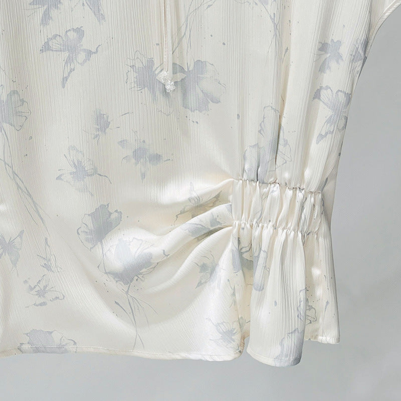 Damebluse med blomsterdesign og raffineret rynkeelement Stilla