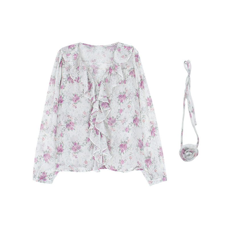 Dame rynket bluse med blomsterdesign og sarte detaljer Stilla