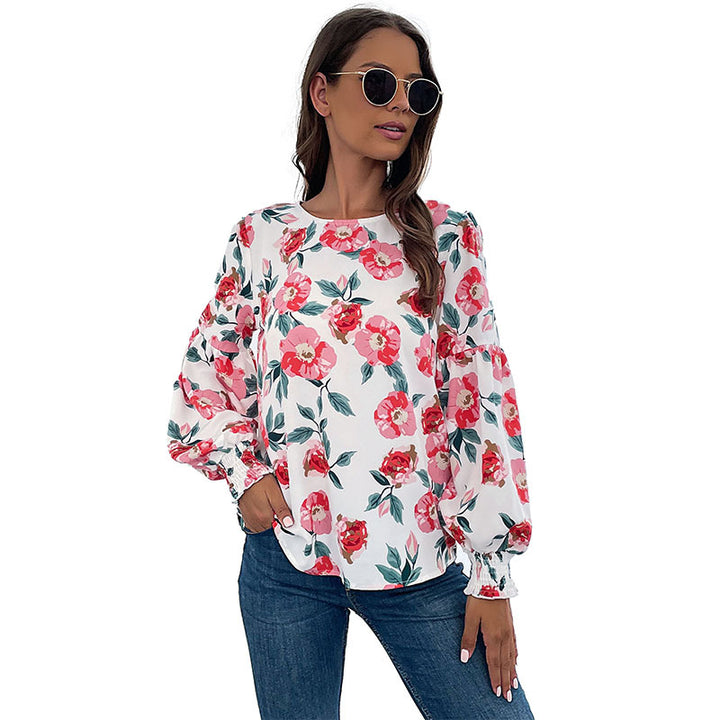 Damebluse med blomstertryk og voluminøse ærmer Stilla