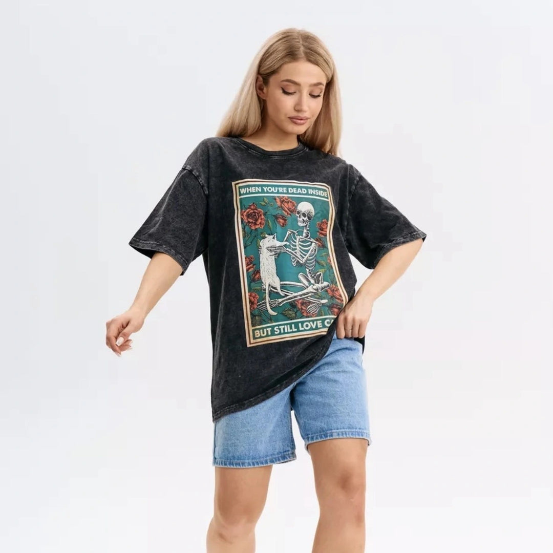 Dame T-shirt med kreativt skeletdesign og legende dyremotiv Stilla