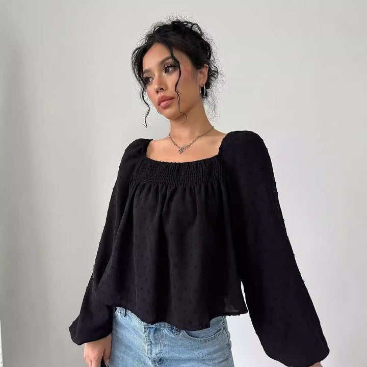 Damer elegant bluse med luftige pufærmer og struktureret overflade Stilla