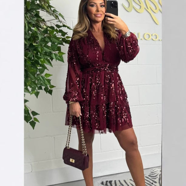 Dame Glitrende Wrapped Dress med voluminøse ærmer og elegant taljebælte Stilla