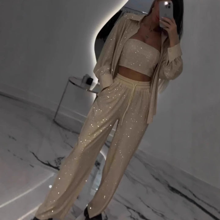 Dame fritids-loungewear sæt med glitrende top og elastiske bukser Stilla